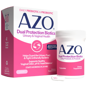 AZO Dual Protection Biotics dietary supplement shown with its retail box, a white bottle with a pink label, and two capsules on a clean white background.